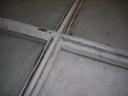Put some putty on the frame where the glass will sit