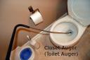 Using a “closet auger” to clear a clog