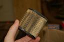 This filter could likely be cleaned with compressed air or a brush. I chose to just replace it.
