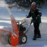 Man with large snowblower