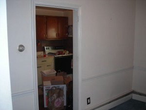 This wall between the dining room and the kitchen needs to go