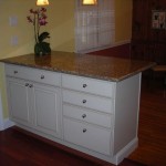Without the wall we were abble to add some base cabinets for much needed storage and a countertop to acomodate a few stools. Without the wall we were abble to add some base cabinets for much needed storage and a countertop to acomodate a few stools.