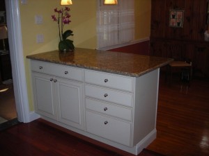 Without the wall we were abble to add some base cabinets for much needed storage and a countertop to acomodate a few stools. Without the wall we were abble to add some base cabinets for much needed storage and a countertop to acomodate a few stools.