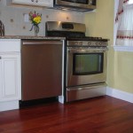 The Santos Mahogany prefinished hardwood floor is an awesome change from the dingy vinyl floor. The Santos Mahogany prefinished hardwood floor is an awesome change from the dingy vinyl floor.