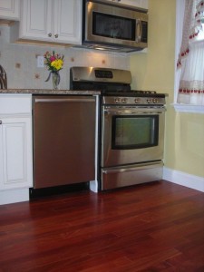The Santos Mahogany prefinished hardwood floor is an awesome change from the dingy vinyl floor.