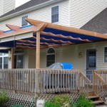 This western red cedar pergola makes a nice addition to an existing deck This western red cedar pergola makes a nice addition to an existing deck